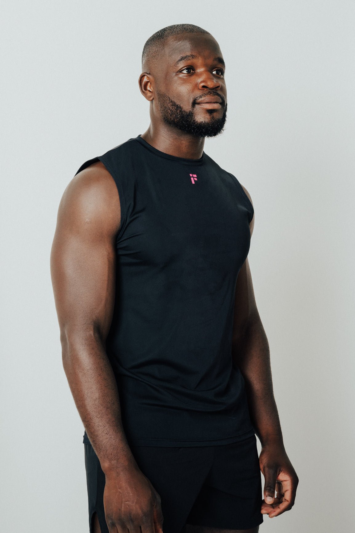 MALE TRANSFORM BLACK AND PINK TECHNICAL SLEEVELESS GYM WORKOUT TOP - INFORM ACTIVE